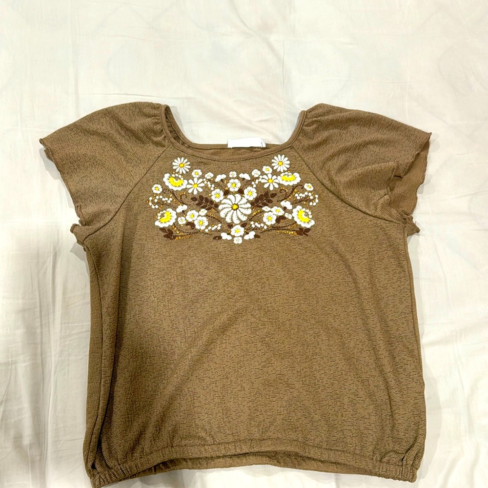 Beautees brown shirt with daisy’s near the chest part